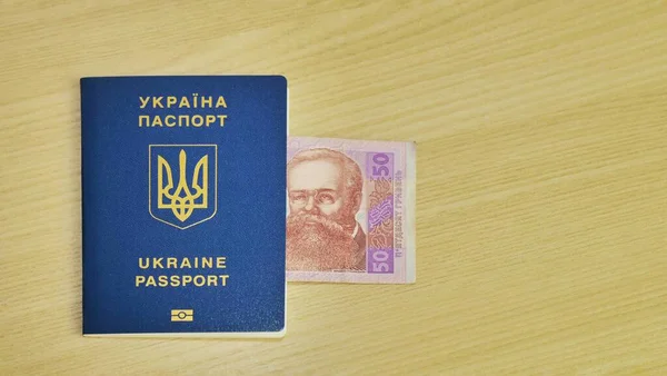 Ukrainian international biometric passport and bag for travel close up,Translation from Ukrainian Ukraine,passport