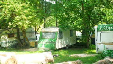 Old camper van standing on parking lot.