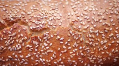 bread with sesame seeds. Baking Italian organic bread. Slow motion cooking