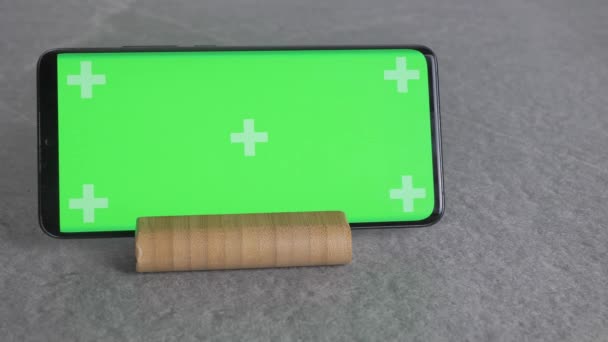 Vertical Video Phone Green Background Stand Wooden Stand — Stock Video