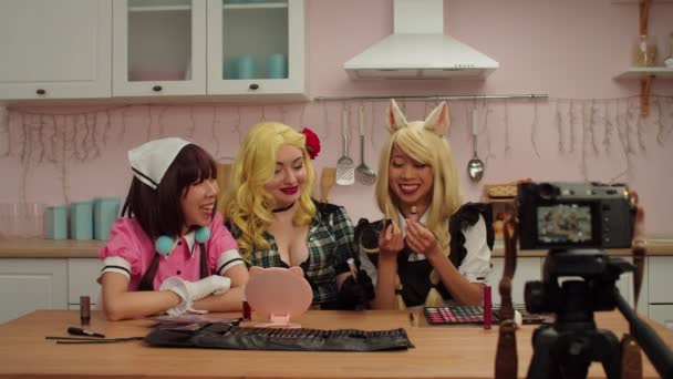 Cheerful female cosplayers live streaming beauty blog using video camera — Stock Video