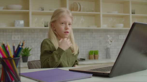 Adorable girl with hearing loss speaking with sign language during video call — Stock Video