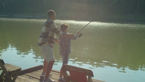 Caring Handsome African American Dad Teaching Cute Preadolescent Son Fish — Vídeo de Stock
