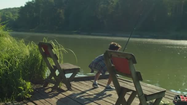 Cute School Age Arab Boy Catching Freshwater Fish Spin Fishing — 비디오