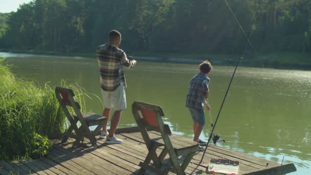 Positive African American Father Spin Fishing Rod Standing Wooden Jetty — Video