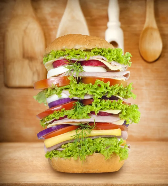 Sandwich very big on vintage wooden boards — Stock Photo, Image