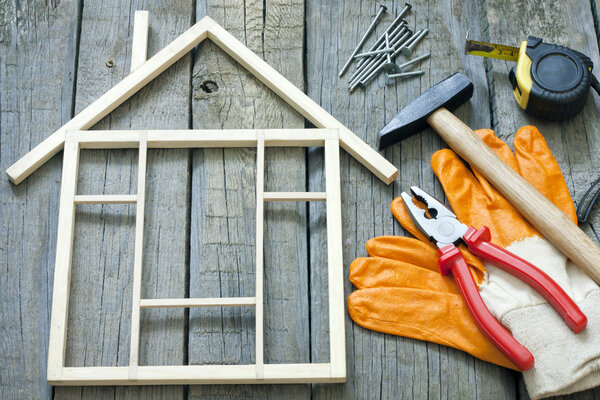 House construction renovation abstract background and tools