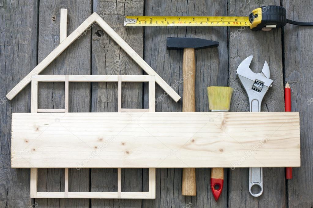 Wooden house construction renovation and tools background