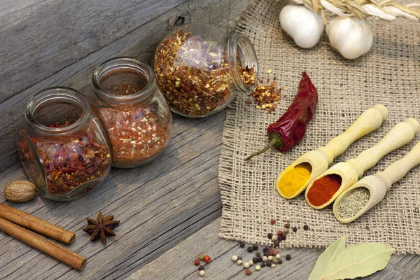 Spices and herbs on old vintage wooden boards in the kitchen — Stock Photo, Image