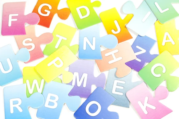 Abstract colorful background with puzzle letters — Stock Photo, Image