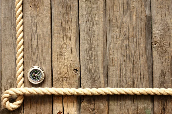 Oude houten planken en touw met kompas vintage achtergrond — Stockfoto