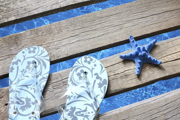 Beachwear on the pier at sea holiday vacation background concept — Stock Photo, Image