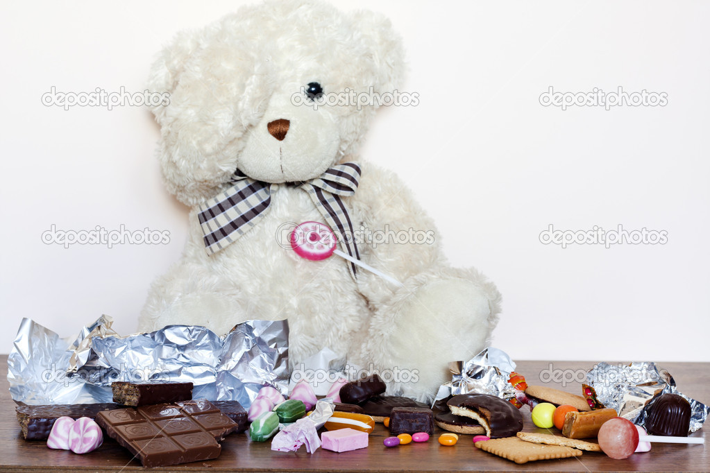 Addiction of eating sweets creative concept with teddy bear