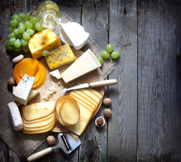 Various types of cheese with empty space background concept