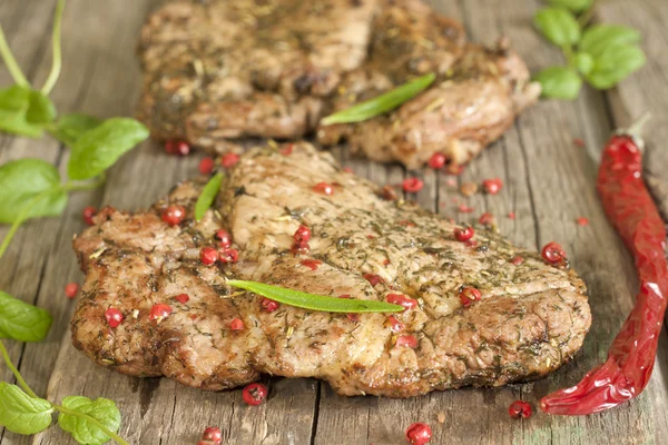 Grilled pork steak meat with herbs and spices — Stock Photo, Image