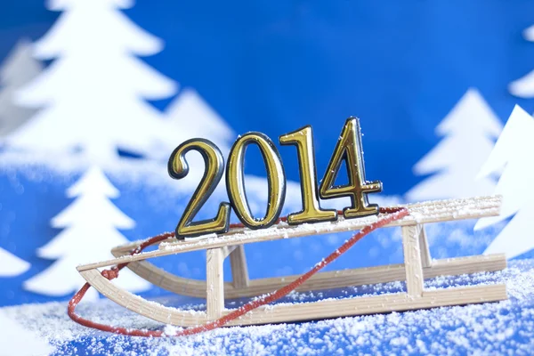 2014 new year numbers on sled abstract on snow background — Stock Photo, Image