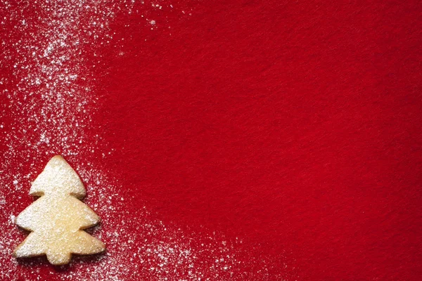 Fondo abstracto de Navidad con galletas en tela roja — Foto de Stock