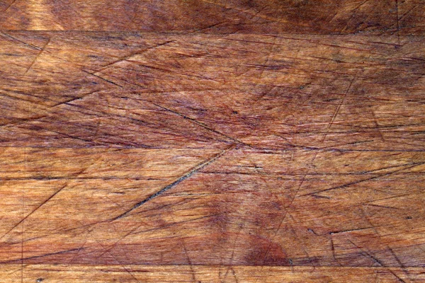 Textura de fondo de tabla de cortar de madera vieja con arañazos — Foto de Stock