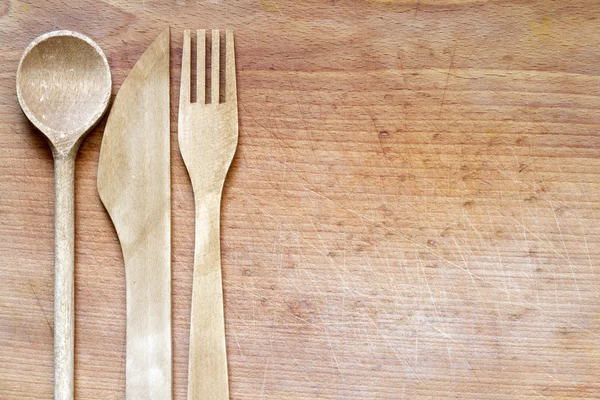 Kayu sendok garpu pada memotong papan abstrak latar belakang makanan — Stok Foto