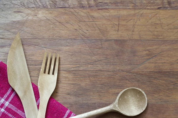 Cubertería de madera sobre tabla de cortar fondo de alimentos abstracto — Foto de Stock