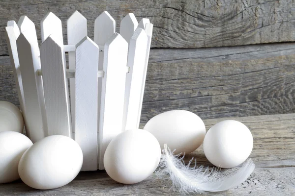 Abstract easter organic eggs on vintage boards in chicken coop — Stock Photo, Image