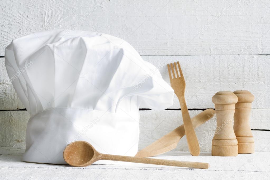 Chef hat and wooden kitchenware food abstract on white boards