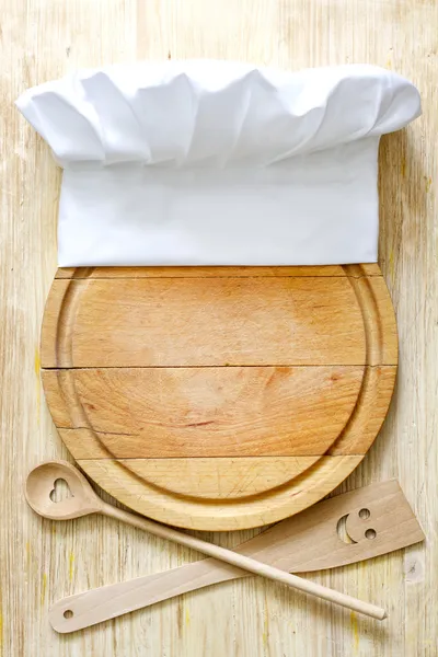 Chef hat on cutting board abstract food concept — Stock Photo, Image