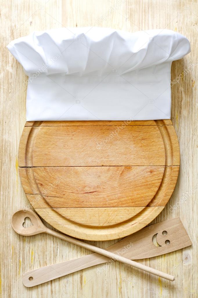 Chef hat on cutting board abstract food concept