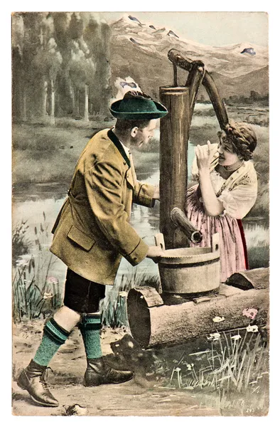 Забавная флиртующая пара в типичном баварском трахтовом платье — стоковое фото