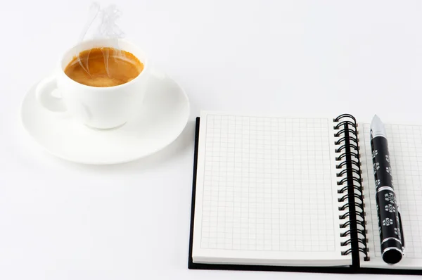 Cup of hot coffee and open note book — Stock Photo, Image