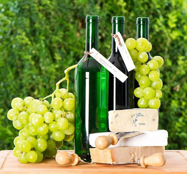 Bottle of wine, grape and cheese — Stock Photo, Image
