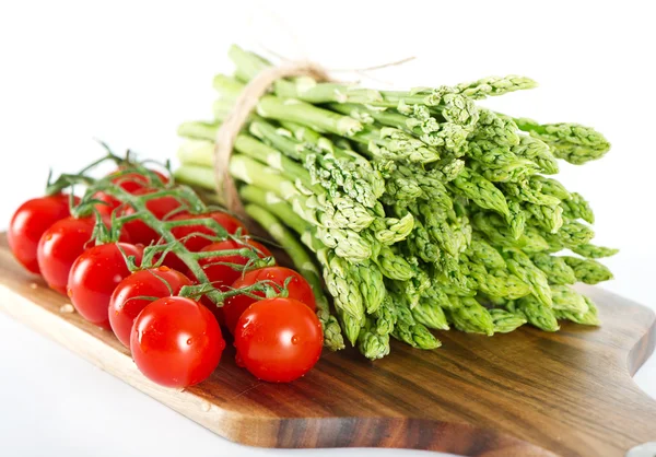 Vegetables. asparagus and tomatoes — Stock Photo, Image