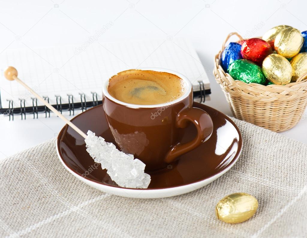 Black coffee with chocolate easter eggs — Stock Photo © LiliGraphie