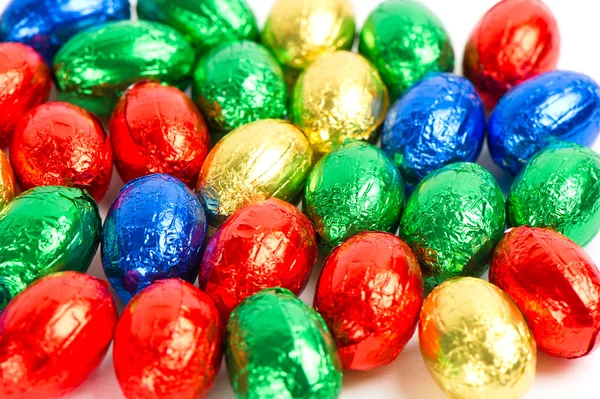 Chocolate easter eggs in colorful foil — Stock Photo, Image