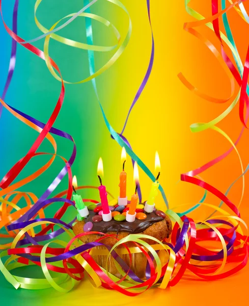 Birthday cupcake with candles and colorful decoration — Stock Photo, Image