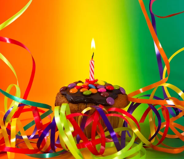 Birthday cupcake and burning candle — Stock Photo, Image