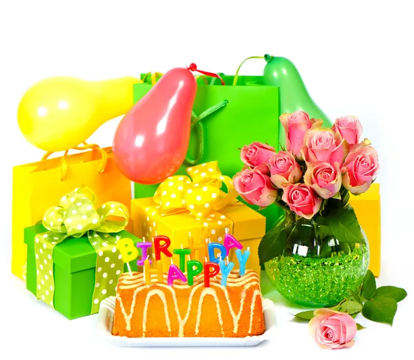 Birthday party decoration with roses, balloons, cake, candles an — Stock Photo, Image