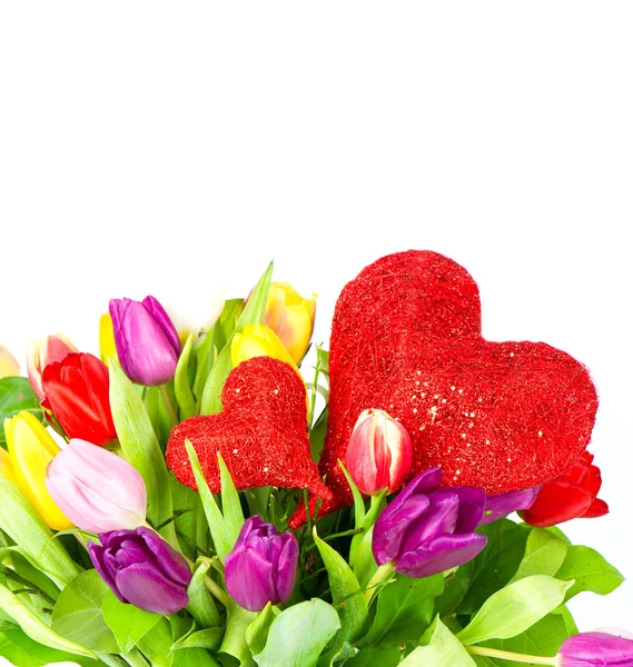 Bouquet of fresh colorful tulips flowers with valentine hearts — Stock Photo, Image