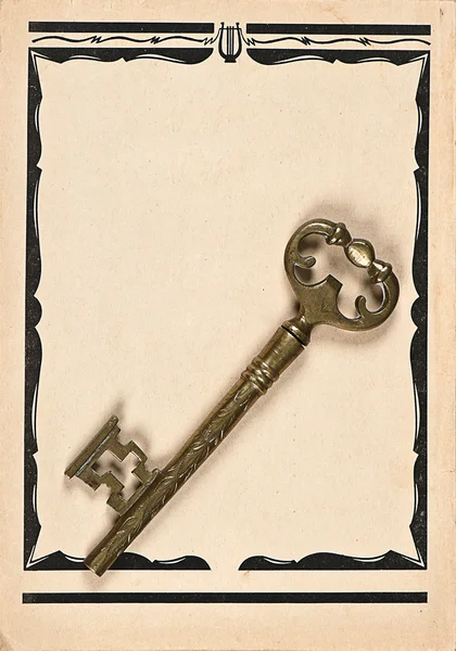 Uma chave sobre fundo de papel vintage — Fotografia de Stock