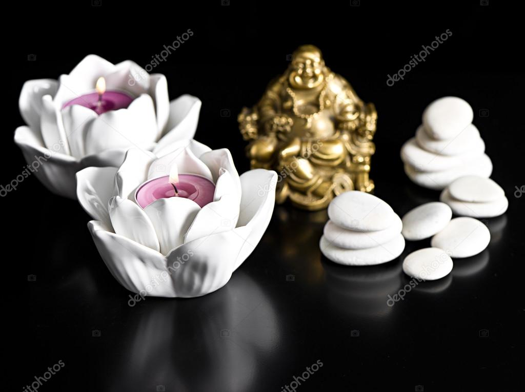candles, buddha and stones. spa and wellness concept