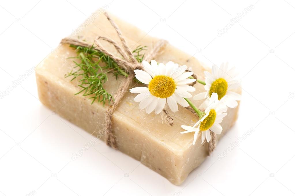Soap bar with fresh chamomile flowers