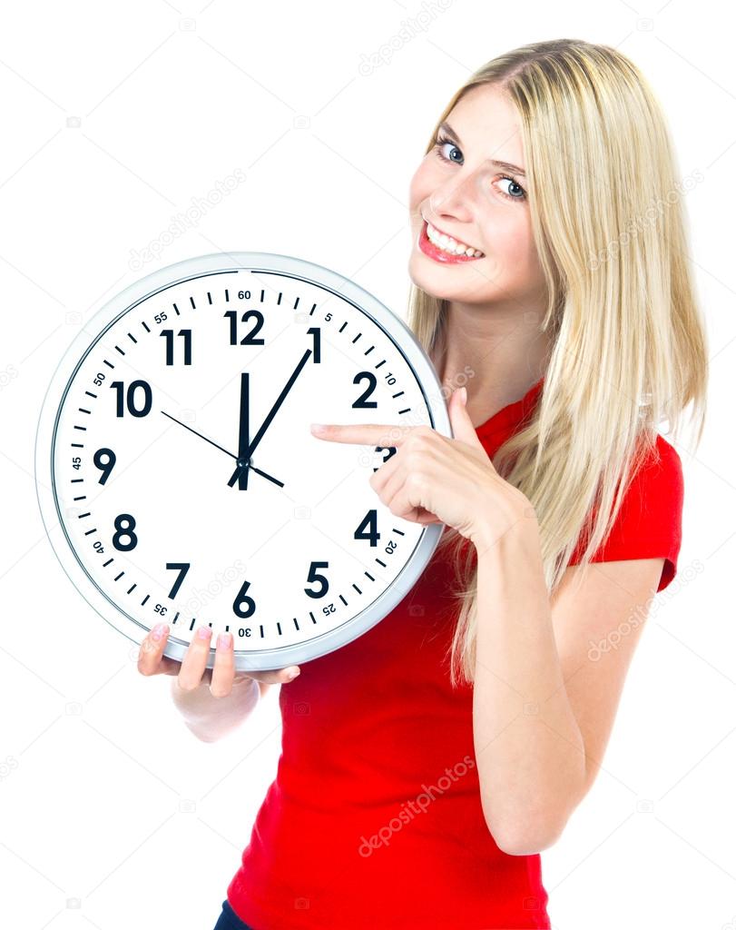 Young woman holding a clock. time management concept