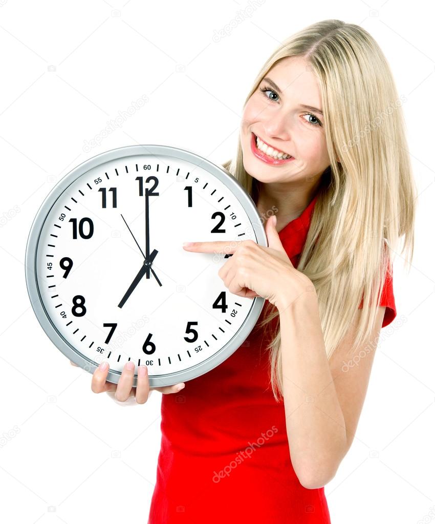young woman holding a clock