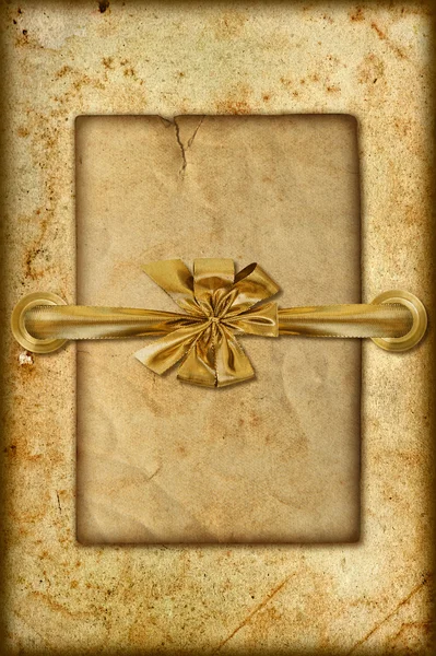 Grungy card with golden ribbon — Stock Photo, Image
