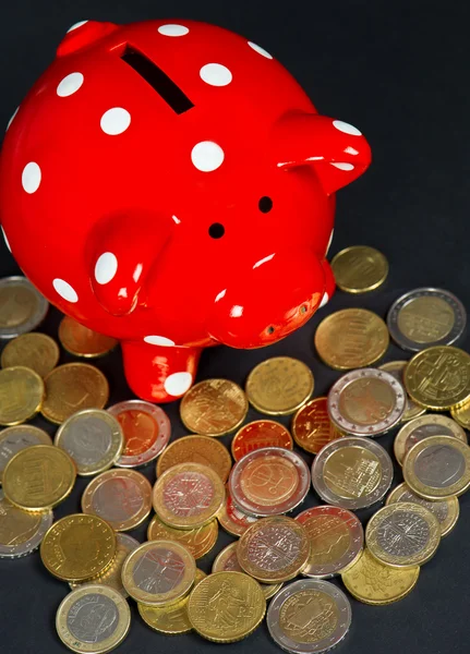 Red saving pig with coins — Stock Photo, Image