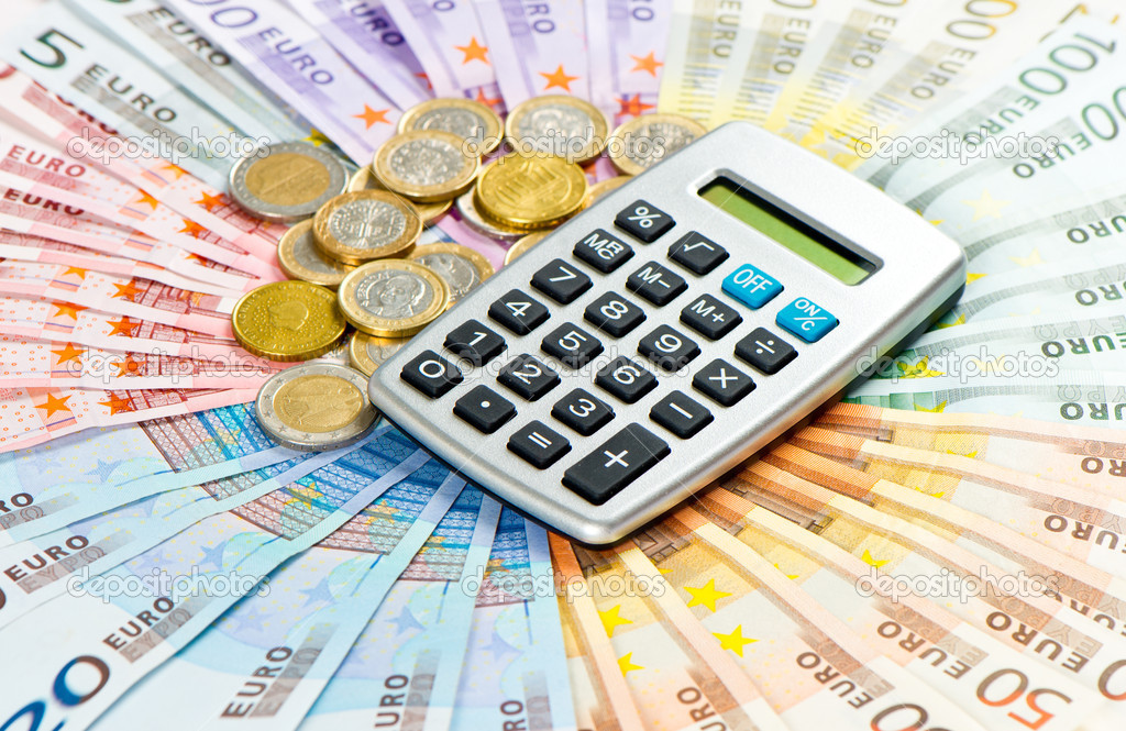 calculator on euro coins and banknotes background