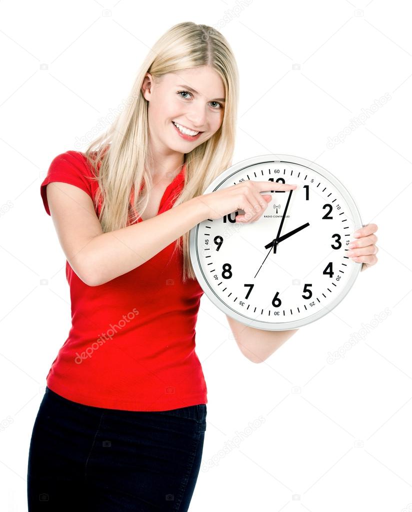 young woman holding a clock. time management