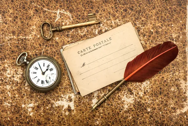 Nostalgic background with postcards and pen — Stock Photo, Image