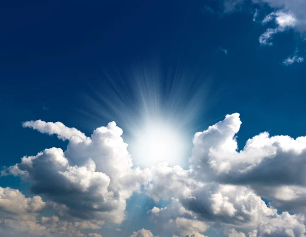 Dramatic blue sky with clouds and sun rays — Stock Photo, Image