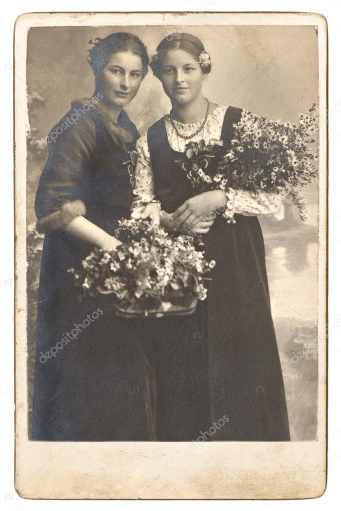 Portrait of two young women with flowers